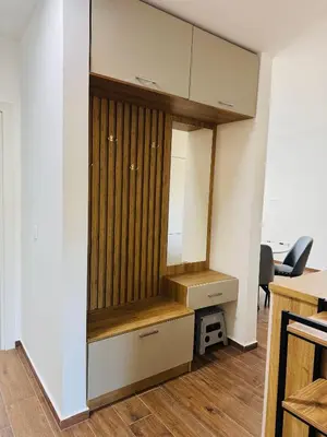 a room with a closet with a wooden partition at Mellas Premium Apartment in Dobra Voda