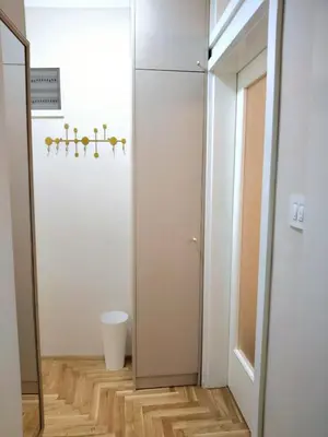 a small bathroom with a toilet and a mirror at Felicia Apartments in Budva