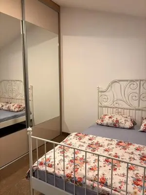 a bedroom with a bed and a mirror at My big house in Kotor