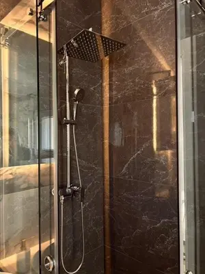 a shower with a glass door in a bathroom at My big house in Kotor