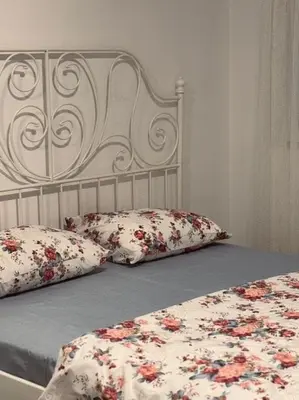 a bed with two pillows on top of it at My big house in Kotor