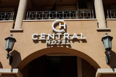 a sign on the front of a central hotel at Central Hotel & Restaurant in Budva