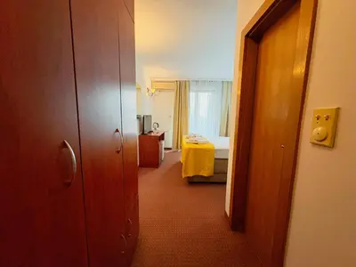 a hallway of a hotel room with a bedroom at Central Hotel & Restaurant in Budva
