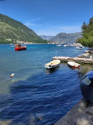 a group of boats in a large body of water at Apartment Noel Kotor Dobrota in Kotor