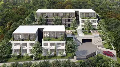 an aerial view of a building with a parking lot at Villa Old Mariner Lux in Kotor