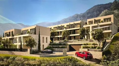 a building with a red car parked in front of it at Villa Old Mariner Lux in Kotor