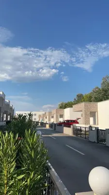 a view of a street with buildings and a blue sky at Vila Dior Donji Stoj in Donji Štoj