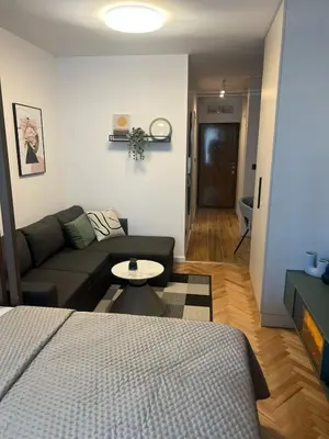 a living room with a couch and a bed at Stella Andrea Luxury Apartment in Bar