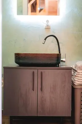 a sink on top of a cabinet in a bathroom at Olive Hills holiday homes 3 in Dobra Voda