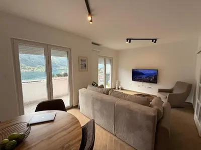 a living room with a couch and a table at Boka View Martiva in Kotor