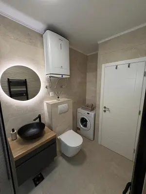 a bathroom with a toilet and a sink and a mirror at Boka View Martiva in Kotor