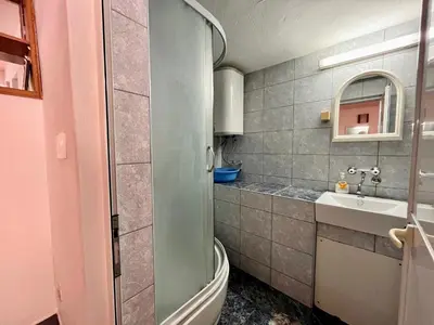a bathroom with a toilet and a sink at Apartments Gvozdenović in Petrovac na Moru