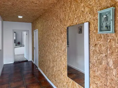 a hallway of a home with a stone wall at Ceres Apartments in Utjeha
