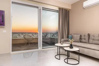 a living room with a couch and a table at Apartments Piano in Utjeha