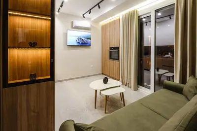 a living room with a couch and a table at Apartments Piano in Utjeha