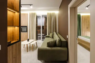 a living room with a couch and a table at Apartments Piano in Utjeha