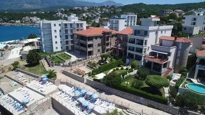 an aerial view of a city with buildings and the water at Apartments Piano in Utjeha