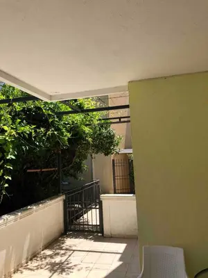 an outside view of a building with a balcony at Mia apartments in Petrovac near the sea in Petrovac na Moru