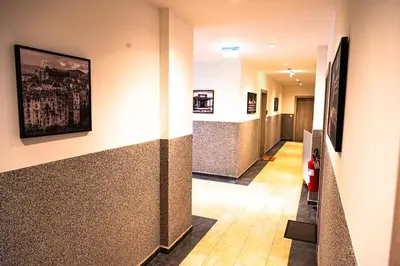 a hallway of a building with a hallway at Modern City Flat Budva - Balcony & Garage Included in Budva