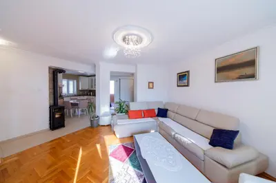a living room with a couch and a table at Apartment Sambra in Budva