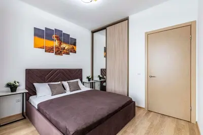 a bedroom with a bed and a sliding glass door at Lipovina Anres Apartment in Petrovac na Moru