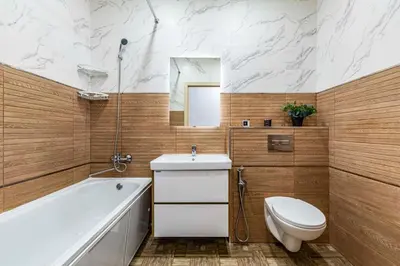 a bathroom with a tub and a toilet and a sink at Lipovina Anres Apartment in Petrovac na Moru