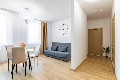 a living room with a couch and a table at Lipovina Anres Apartment in Petrovac na Moru