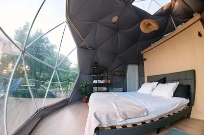 a bedroom in a dome house with a bed in it at GO Glamping in Dobra Voda