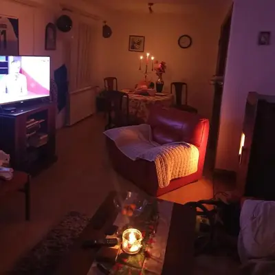 a living room with a couch and a television at Kaludjerovic in Cetinje