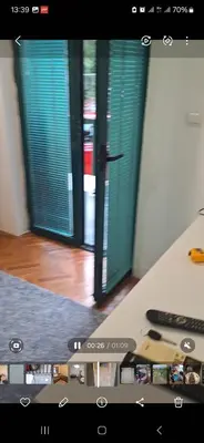 a view of a room with two green doors at Start over in Budva