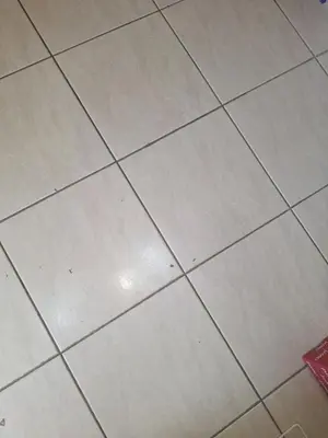 a white tiled floor in a room at Start over in Budva