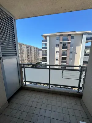 a balcony with a view of a building at City Apartment in Podgorica