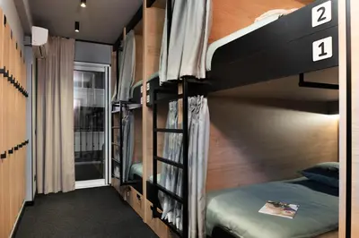a bunk bed room with two bunk beds at U-NIGHT Hostel Budva in Budva