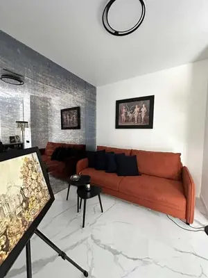 a living room with a couch and a table at Apartments Silversany in Budva