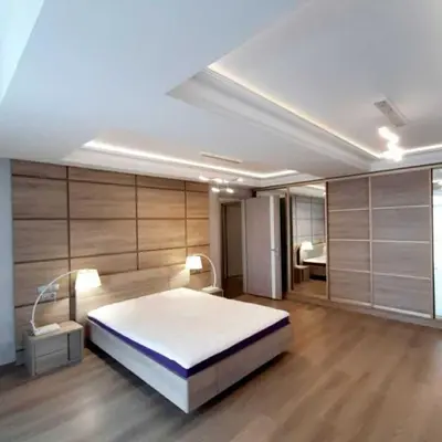 a bedroom with a large white bed in a room at Apartments Jimasly in Budva