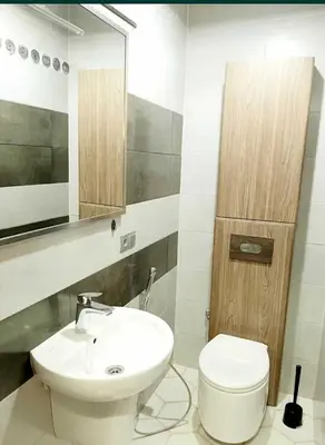 a bathroom with a white sink and a toilet at Apartments Jimasly in Budva