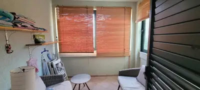 a living room with a couch and a window at Аппартаменты Магнолия in Petrovac na Moru