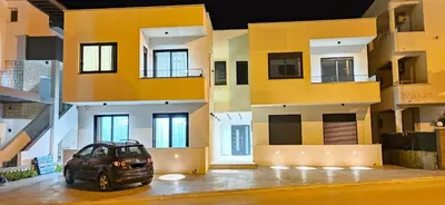 a car parked in front of a building at Bahr DELUX App & Suite in Ulcinj