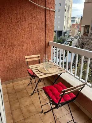 a table and two chairs on a balcony at Budva APT in Budva