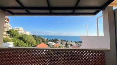 a view of the ocean from a balcony at Golden Sun Apartment 2 in Ulcinj
