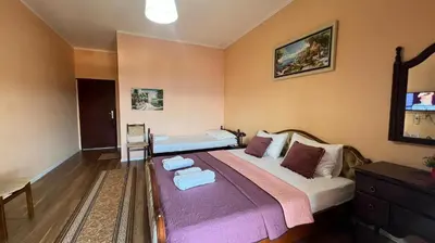 a bedroom with a bed with towels on it at Golden Sun Apartment 2 in Ulcinj
