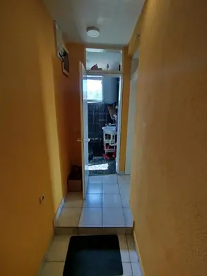 a hallway with a door open to a room at Aprtman 2 in Sutomore