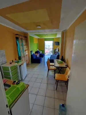 a room with a kitchen and a living room at Aprtman 2 in Sutomore