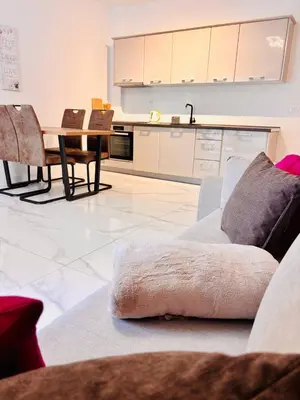 a living room with a couch and a table at Monte Rama Suite Rafailovici in Budva