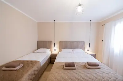 two beds sitting next to each other in a bedroom at Villa Jana Lapčići in Lapčići