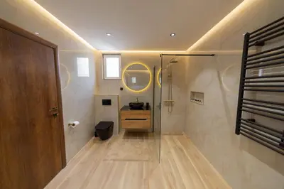 a bathroom with a sink and a mirror at Villa Jana Lapčići in Lapčići
