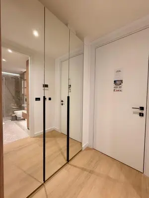 a room with sliding glass doors and a bathroom at Onia Luxury Escape in Budva