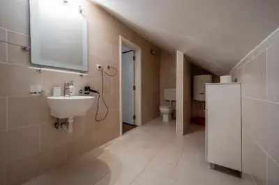 a bathroom with a sink and a toilet at Vila Lancana in Kotor