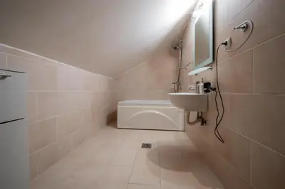 a small bathroom with a sink and a toilet at Vila Lancana in Kotor
