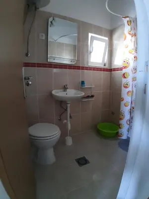 a bathroom with a toilet and a sink at Apartments Snezana in Bar